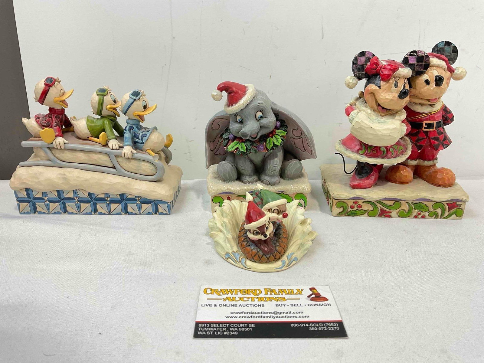 4 pcs Jim Shore ENESCO Disney Showcase Composite Christmas Decorative Figurines.: 4 pcs Jim Shore ENESCO Disney Showcase Composite Christmas Decorative Figurines. Pieces have wear indicative of age and use, one is pitted and stained, another is stained, all are dusty, see pictures