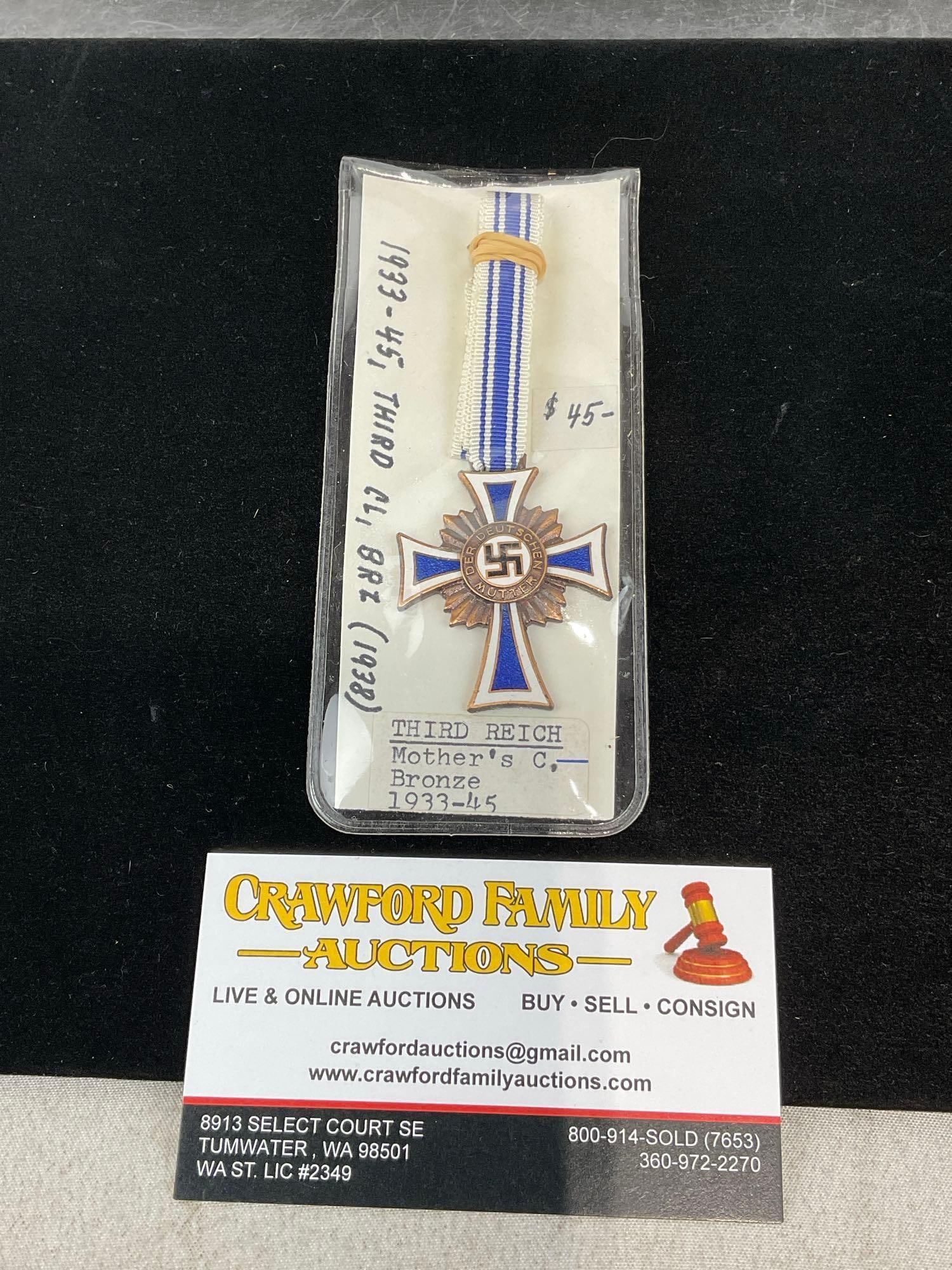 WWII Third Reich Cross of Honour of the German Mother 3rd Class, Bronze Grade, Blue/White Ribbon: All from the same collection. Appears to be in good shape. The piece measures approx 5h x 3w x 2d inches. See pics. E-414