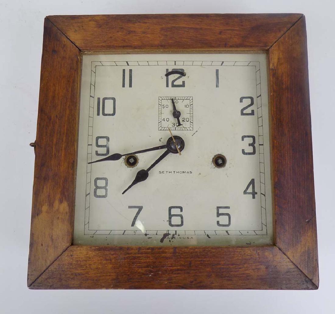 SETH THOMAS WALL CLOCK: THIS IS THE SETH THOMAS GALLARY SQUARE CLOCK. IT HAS ARABIC NUMERALS FACE WITH A 8 DAY MOVEMENT AND SECONDS DIAL 9 X 9 X 3.5D