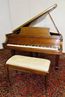 STEINWAY BABY GRAND PIANO: A STEINWAY AND SONS BABY GRAND PIANO IN WALNUT FINISH. M 416660 IS STAMPED ON THE BRIDGE OF THE PIANO. THE PIANO WAS JUST TUNED AND SOUNDS FANTASTIC.