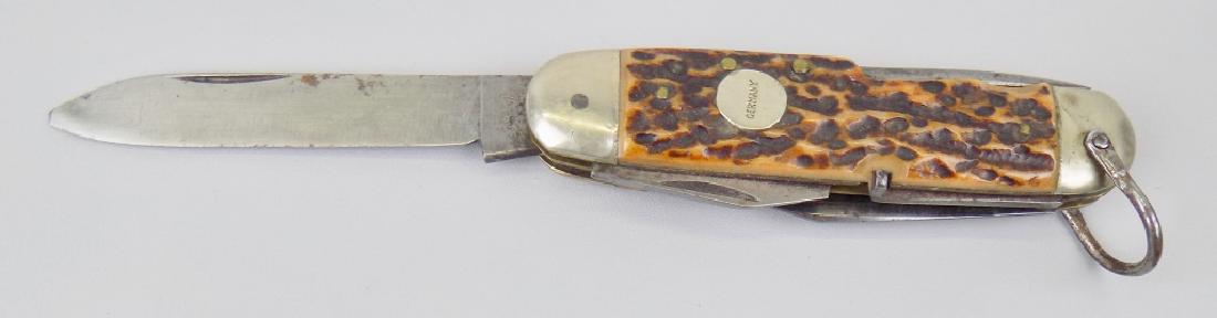UNIMART SOLINGEN FOLDING POCKET KNIFE: SPEAR BLADE, CLIP, PUNCH, CAN OPENER, SCREWDRIVER/CAP LIFTER, CORK SCREW. 3-1/2" CLOSED, 6-1/4" OPEN.