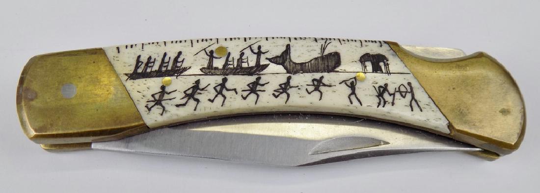 SOLIGEN WHALE HUNT LOCKBACK FOLDING KNIFE: "BEAR HUNTER LB-5" - STAINLESS, HAND CARVED SCRIMSHAW STYLE CARVED HANDLE OF WHALE HUNT. 5" CLOSED, 8-1/2" OPEN.