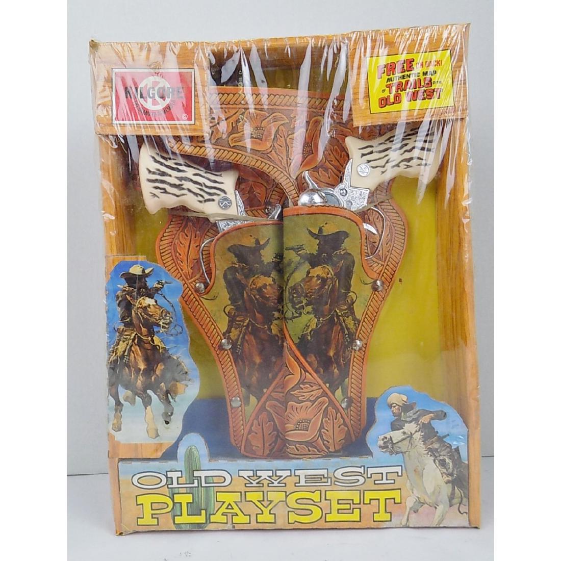 KILGORE OLD WEST CAP PISTOL PLAY SET: BELT WITH TWO HOLSTERS AND TWO GUNS. SEALED BOX. DATED 1970. 10" BY 13-1/2" BOX