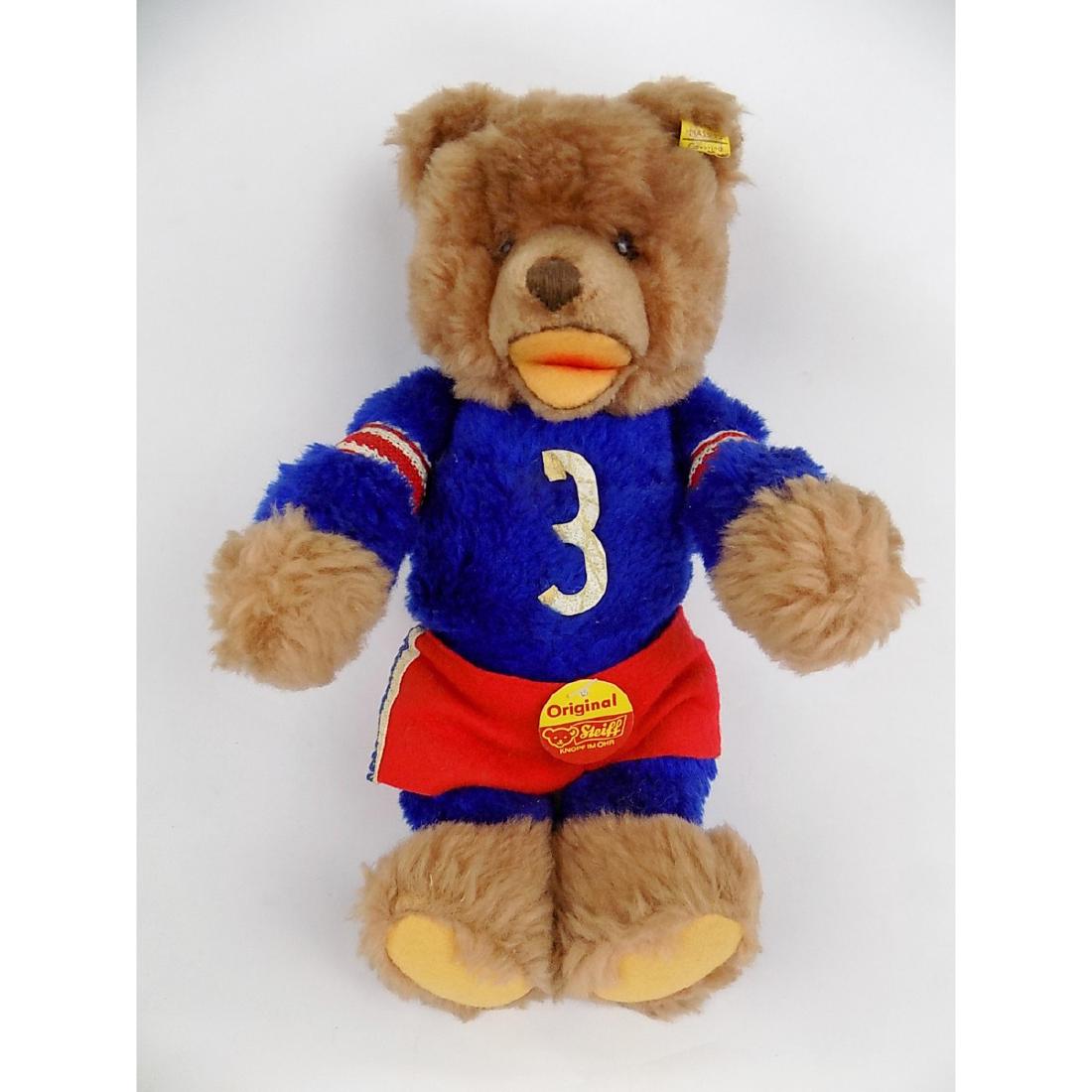STEIFF ZOTTY TEDDY BEAR - HOCKEY SHIRT: FROM 1972-1975. JOINTED, MEATURES 9" SEATED. SCRIPT BUTTON.