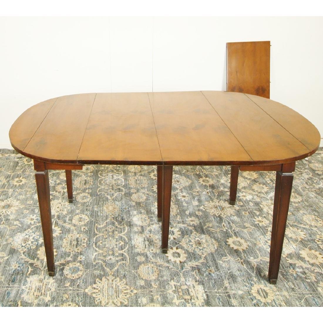 WIDDICOMB DINING TABLE: A JOHN WIDDICOMB EXPANDABLE DINING TABLE WITH THREE LEAVES. TABLE WITH LEAVES MEASURES 72.5"L, WITHOUT LEAVES MEASURES 63"L. 29" HEIGHT.
