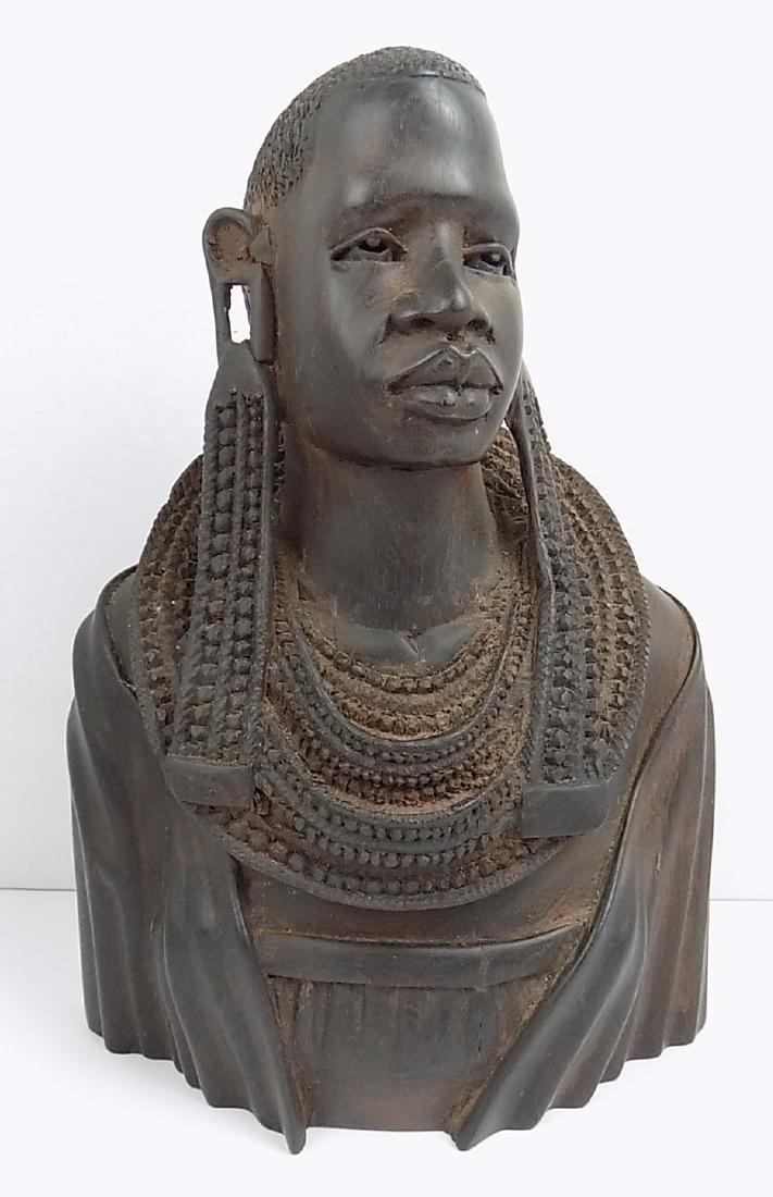 AFRICAN MAASAI FEMALE WOODEN BUST: A LARGE HARDWOOD CARVED MAASAI OR MAKONDE TRIBAL FEMALE BUST. WOOD IS BELIEVED TO BE AN AFRICAN HARDWOOD, TEAK OR EBONY. MEASURES 10.5"H X 8"W.