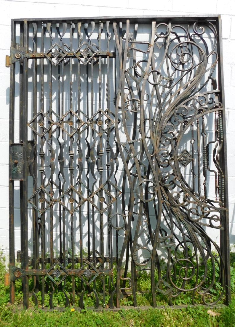SIBERIAN WROUGHT IRON GATE SET: A SET OF HAND FORGED SIBERIAN WROUGHT IRON GATES WITH MODERN IRON DESIGNS AND FLOWING CURVES. MEASURES 71"W X 97"H EACH PANEL