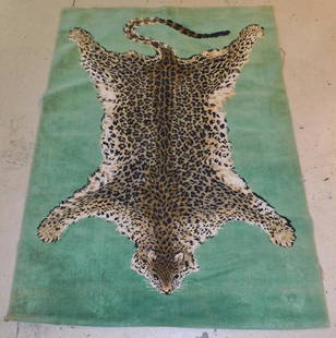 LEOPARD MOTIF THROW RUG: A LEOPARD MOTIV 1960'S THROW RUG. MEASURES 46" X 66".