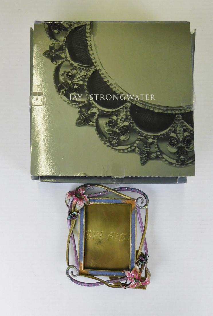 JAY STRONGWATER FRAME: A JAY STRONGWATER FRAME WITH SWARVOSKI EMBEDDED CRYSTALS. MEASURES 3" X 4". BOX MEASURES 5" X 7". SIGNED SPF 5151.