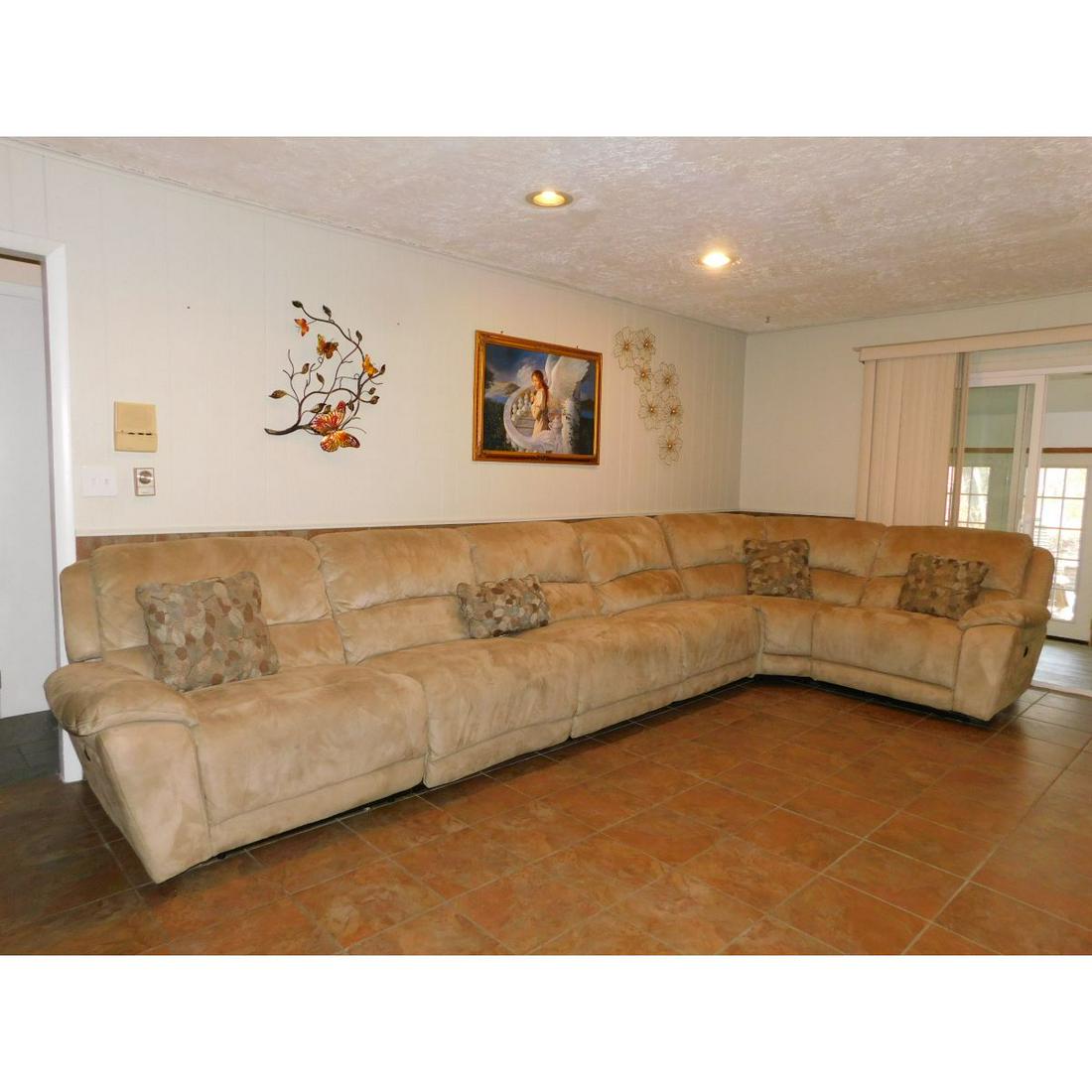 SIX PIECE MICROSUEDE SECTIONAL SOFA: A SIX PIECE MICROSUEDE SECTIONAL SOFA WITH THROW PILLOWS. ALL STRAIGHT PIECES KICK OUT TO MAKE RECLINERS. TWO ENDS ARE ELECTRIC. ITEM HAS BEEN STERILIZED IN ACCORDANCE WITH PA STATE LAW.