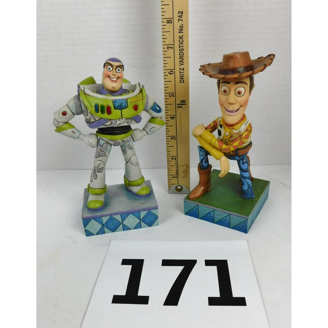JIM SHORE BUZZ AND WOODY COLLECTIBLE FIGURES: JIM SHORE FOR DISNEY TRADITIONS SHOWCASE COLLECTION 7" BUZZ LIGHTYEAR AND WOODY COLLECTIBLE FIGURINES FROM THE TOY STORY MOVIE.
