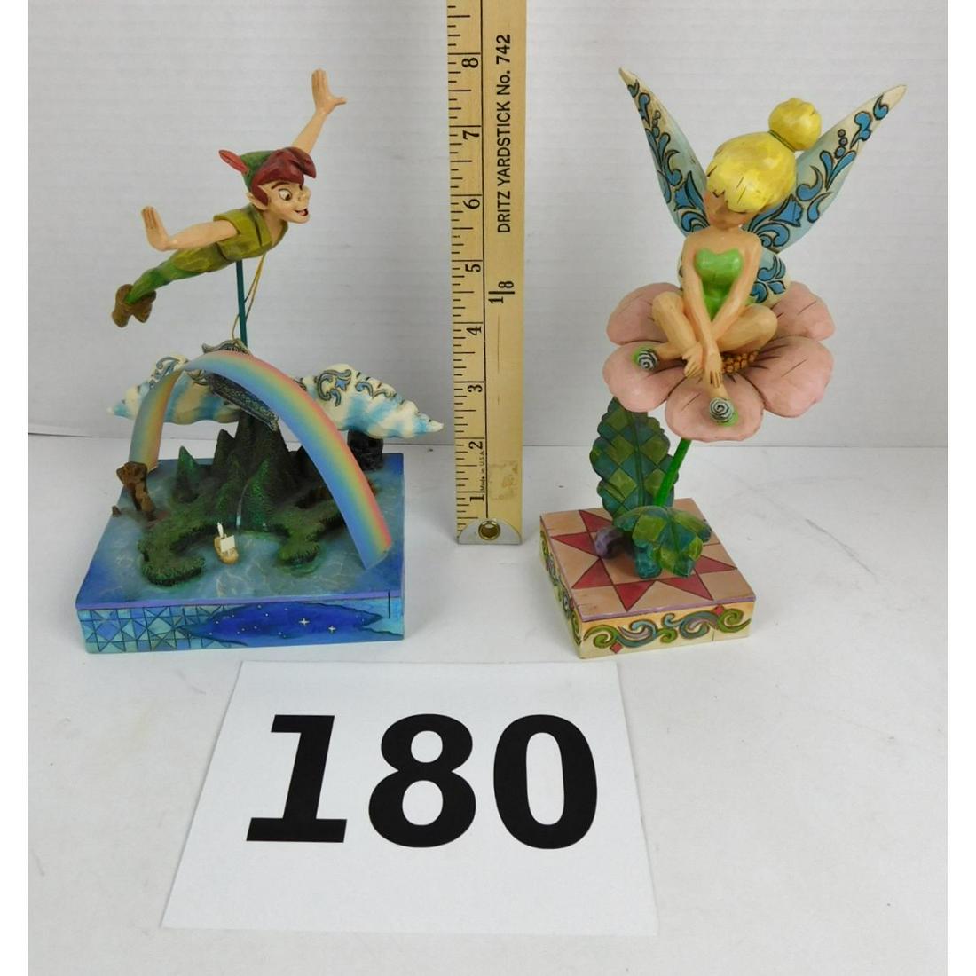 JIM SHORE DISNEY FIGURINE LOT: A LO TOF TWO JIM SHORE FOR DISNEY'S SHOWCASE COLLECTION FIGURINES. ONE PETER PAN ENTITLED "SOARS TO THE STARS" AND TINKER BELL ENTITLED "SITTING PRETTY".