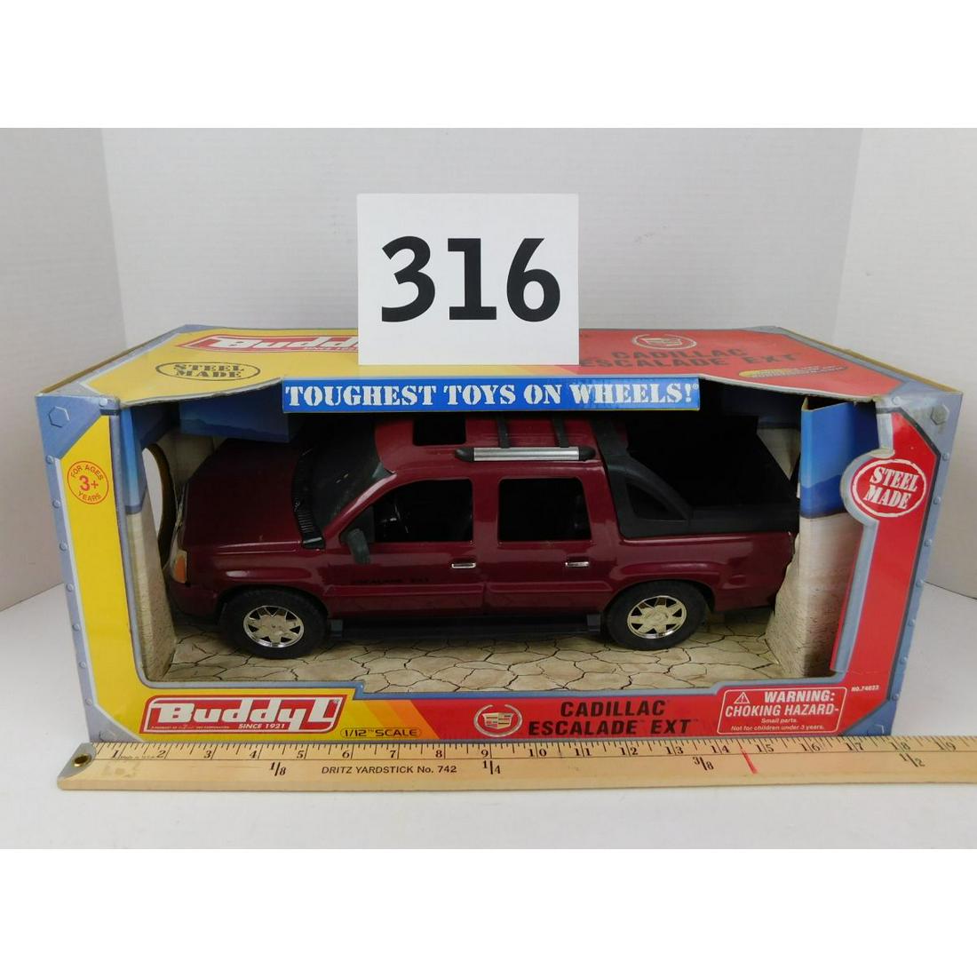 BUDDY L CADILLAC ESCALADE MODEL: A BUDDY L STEEL CADILLAC ESCALADE EXT STILL IN THE ORIGINAL BOX.