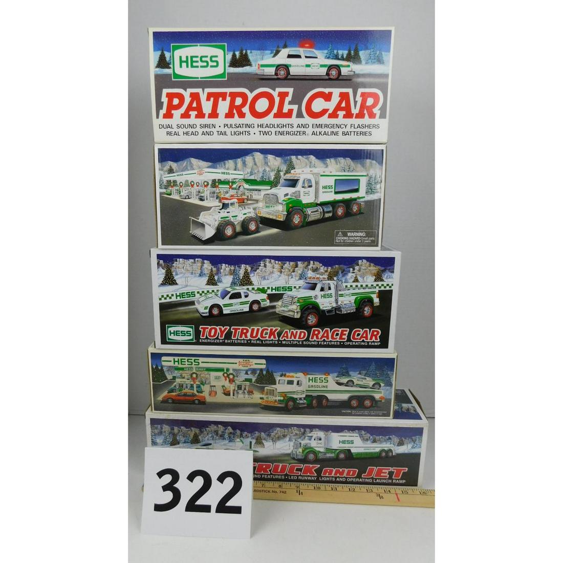 LOT OF FIVE HESS TRUCKS: A LOT OF FIVE STILL IN BOX HESS TRUCKS. YEARS 1991, 1993, 2008, 2010, AND 2011.