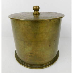 TRENCH ART BRASS URN: A BRASS TRENCH ART URN. LABELED RM. CO. DEC 1944. LOT 2256. IT IS MADE FROM THE BASE OF A 5 INCH MARK 5 38 CAL SPENT ROUND CASING. PLEASE SEE PHOTOGRPAHS. MEASURES 6"DIAMETER X 6"H.