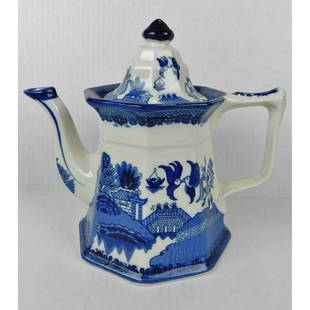 FENTON IRONSTONE BLUE AND WHITE TEAPOT: A E&C CHALLINOR FENTON IRONSTONE BLUE AND WHITE LIDDED TEAPOT. MEASURES 8.5"H X 10"W.