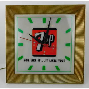VINTAGE 7 UP ADVERTISING CLOCK: A VINTAGE LIGHTED 7 UP ADVERTISING CLOCK. ORIGINAL TIN BACKING. MEASURES 15.5" SQUARE.