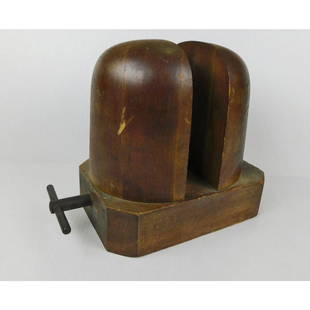 ANTIQUE WOODEN HAT MOLD: AN ANTIQUE WOODEN HAT MOLD WITH TURNSCREW. MEASURES 12"W X 6.5"D X 9"H.