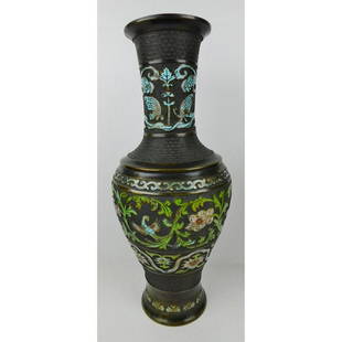 BRONZE AND ENAMEL DECORATIVE ASIAN VASE.: A BRONZE VASE WITH EMBOSSED DECORATION ACCENTED WITH ENAMEL PAINT. ASIAN FLORAL BIRD MOTIF. MEASURES 20"H.