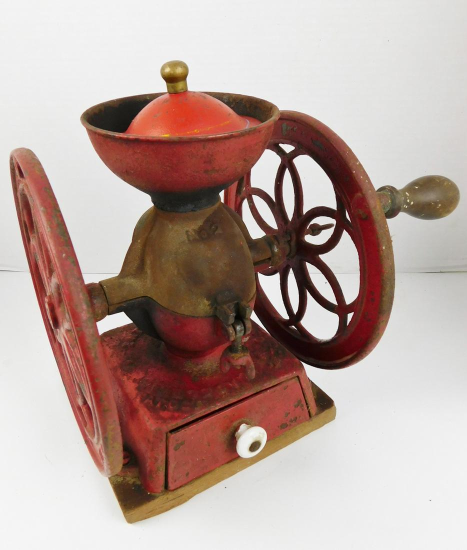 ANTIQUE ENTERPRISE COFFEE GRINDER: AN ANTIQUE ENTERPRISE DOUBLE WHEEL COFFEE GRINDER. MEASURES 10" SQUARE X 8"H. PLEASE SEE PHOTOGRAPHS.