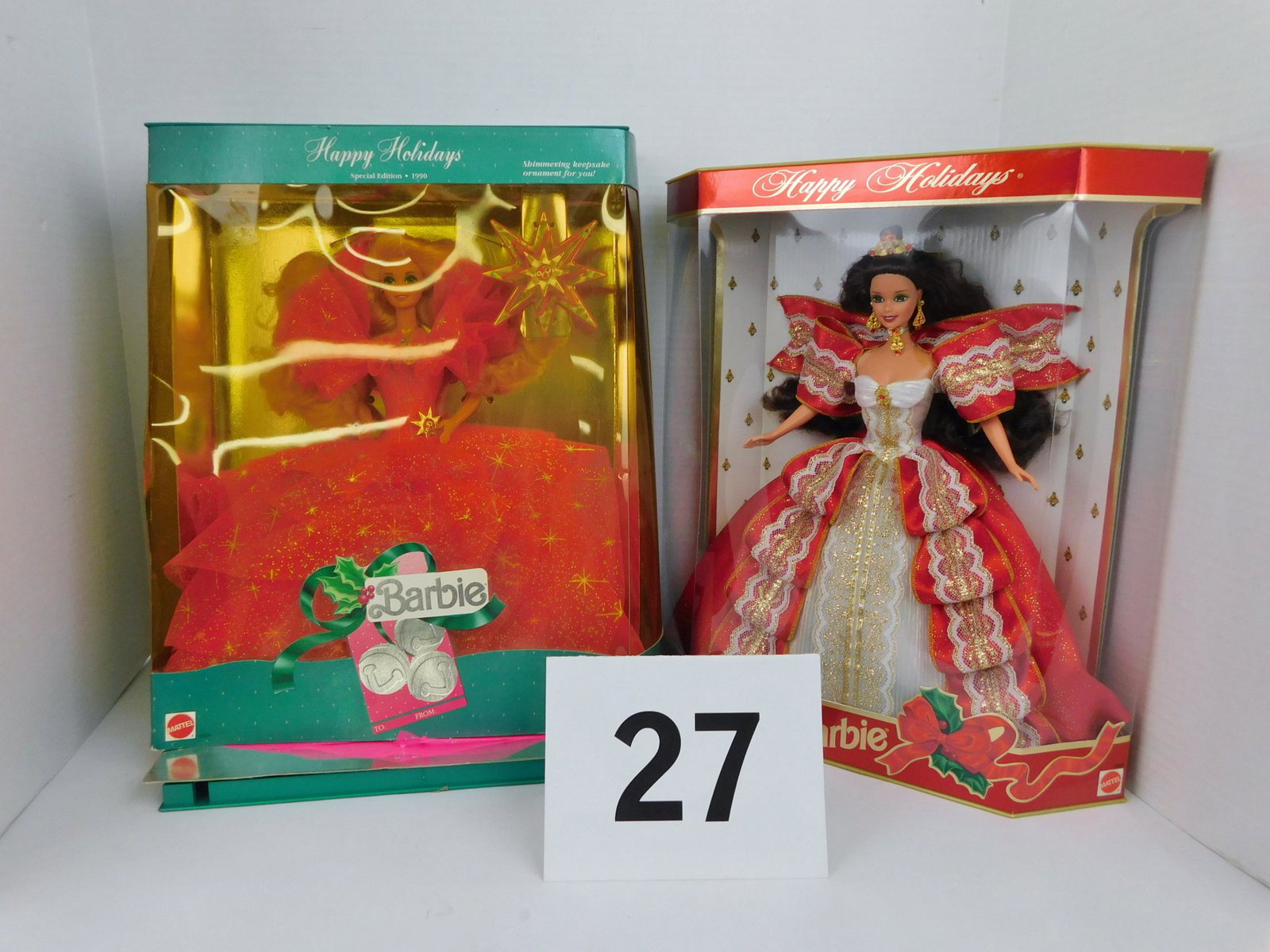 LOT OF TWO SPECIAL EDITION BARBIE DOLLS: A LOT OF TWO SPECIAL EDITION BARBIE DOLLS IN BOXES. ONE 1990 HAPPY HOLIDAYS BARBIE MEASURING 15"L X 12"W BOX ONLY AND ONE 1997 10TH ANNIVERSARY HAPPY HOLIDAYS BARBIE MEASURING 14" X 13" BOX ONLY.