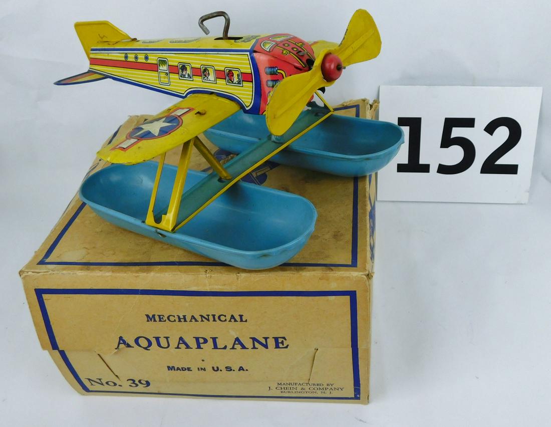 VINTAGE MECHANICAL WIND-UP AQUAPLANE: A VINTAGE MECHANICAL WIND-UP AQUAPLANE TIN TOY. WITH ORIGINAL BOX. MANUFACTURED BY THE J. CHEIN AND COMPANY. PLANE IS IN WORKING CONDITION. BOX IS SLIGHTLY AS-IS. PLEASE SEE PHOTOGRAPHS. BOX MEASURES