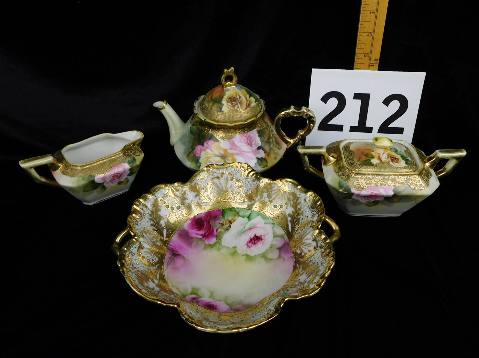 FOUR PIECE DECORATED NIPPON: A LOT OF FOUR PIECES OF HAND PAINTED NIPPON. TEA POT, CREAMER, SUGAR, AND MATCHING BOWL. PLEASE SEE PHOTOGRAPHS. BOWL MEASURES 8.5"W X 2"H.