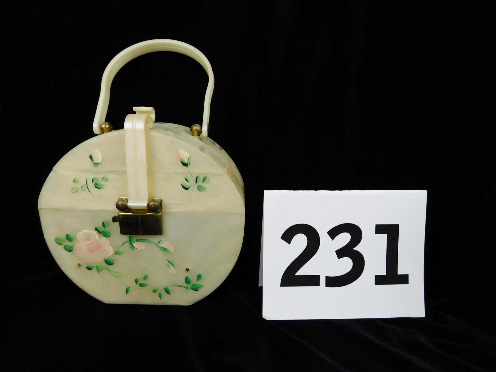 HAND PAINTED PURSE: A HAND PAINTED COMPOSITE PURSE WITH BUILT IN MIRROR. MEASURES 6.5"W X 6.5"H X 3.25"D.
