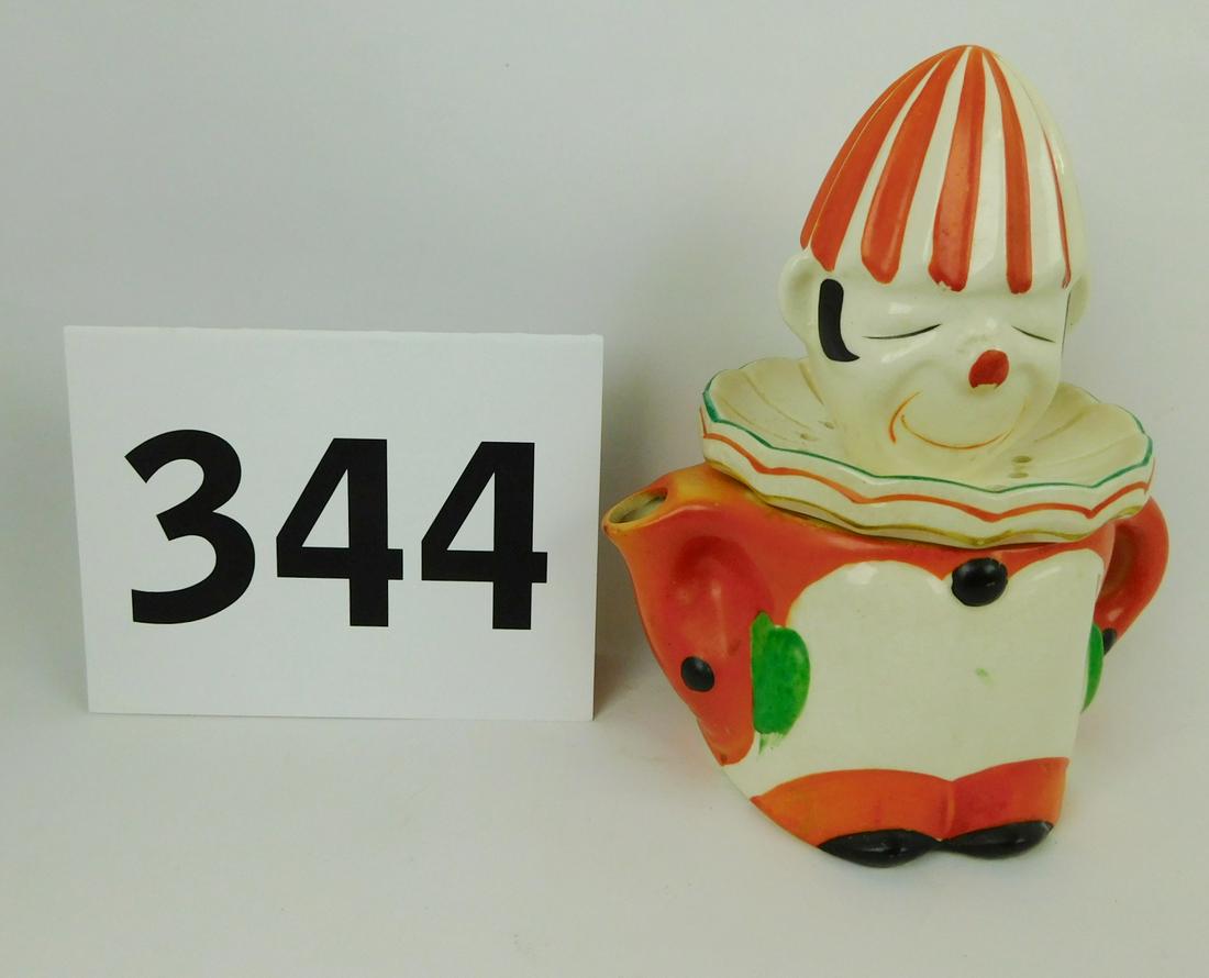 VINTAGE CLOWN JUICER WITH POT: A VINTAGE JAPANESE CLOWN FIGURAL JUICER WITH POT. HAND PAINTED. MEASURES 7"H X 7"W.
