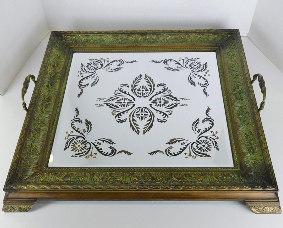 SQUARE RUSTIC MIRRORED TRAY: A SQUARE RUSTIC TWO HANDLED DECORATED MIRRORED TRAY. PLEASE NOTE THAT THE MIRRORING APPEARS WHITE AND IS A REFLECTION OF THE WHITE BOARD USED TO PHOTOGRAPH. MEASURES 22" SQUARE.