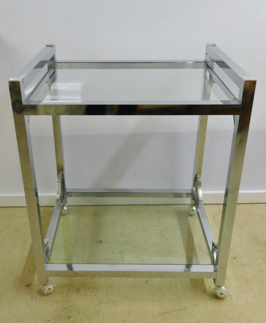 MODERN CHROME GLASS TOP TEA CART: A MODERN CHROME TEA CART WITH GLASS TOP AND BOTTOM. MEASURES 26"W X 20"D X 32"H.