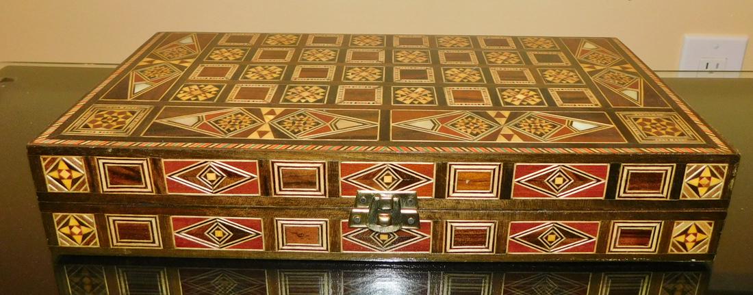 WOODEN INLAID GAME SET: A WOOD INLAID GAME SET. BACKGAMMON AND CHESS. MEASURES 12.5" X 6" WHEN FOLDED.