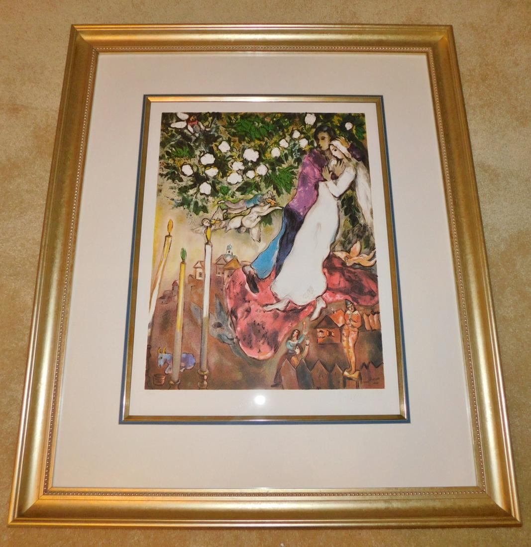 MARC CHAGALL MACHINE PLATE LITHOGRAPH: A MARC CHAGALL MACHINE PLATE LITHOGRAPH. ENTITLED "LES TROIS CIERGES". PRINTED BY ATELIER TET A TET IN PARIS. MEASURES 40" X 33" WITH FRAME.