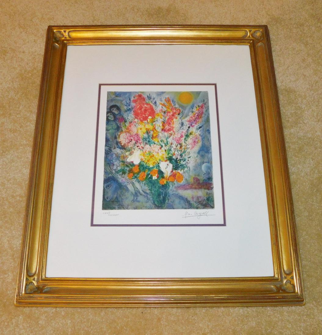 LIMITED EDITION MARC CHAGALL PRINT: A HAND SIGNED AND NUMBERED MARC CHAGALL FLORAL LITHOGRAPH. MEASURES 24" X 20" WITH FRAME.