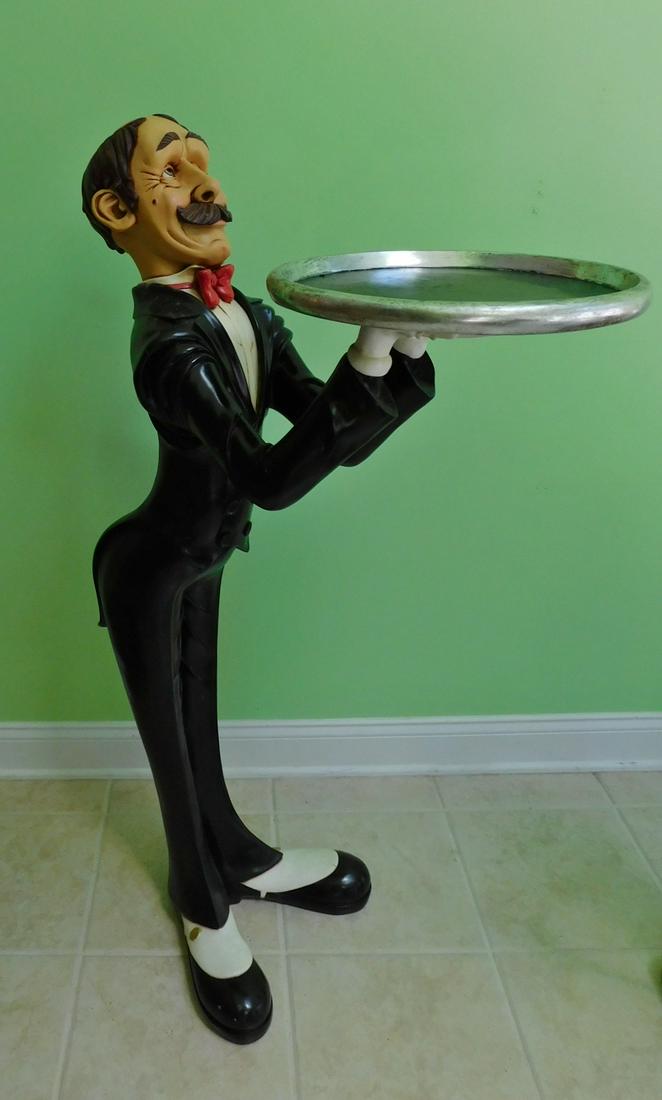 46" BUTLER STATUE: A 46" TALL COMPOSITE BUTLER STATUE WITH SERVING TRAY.