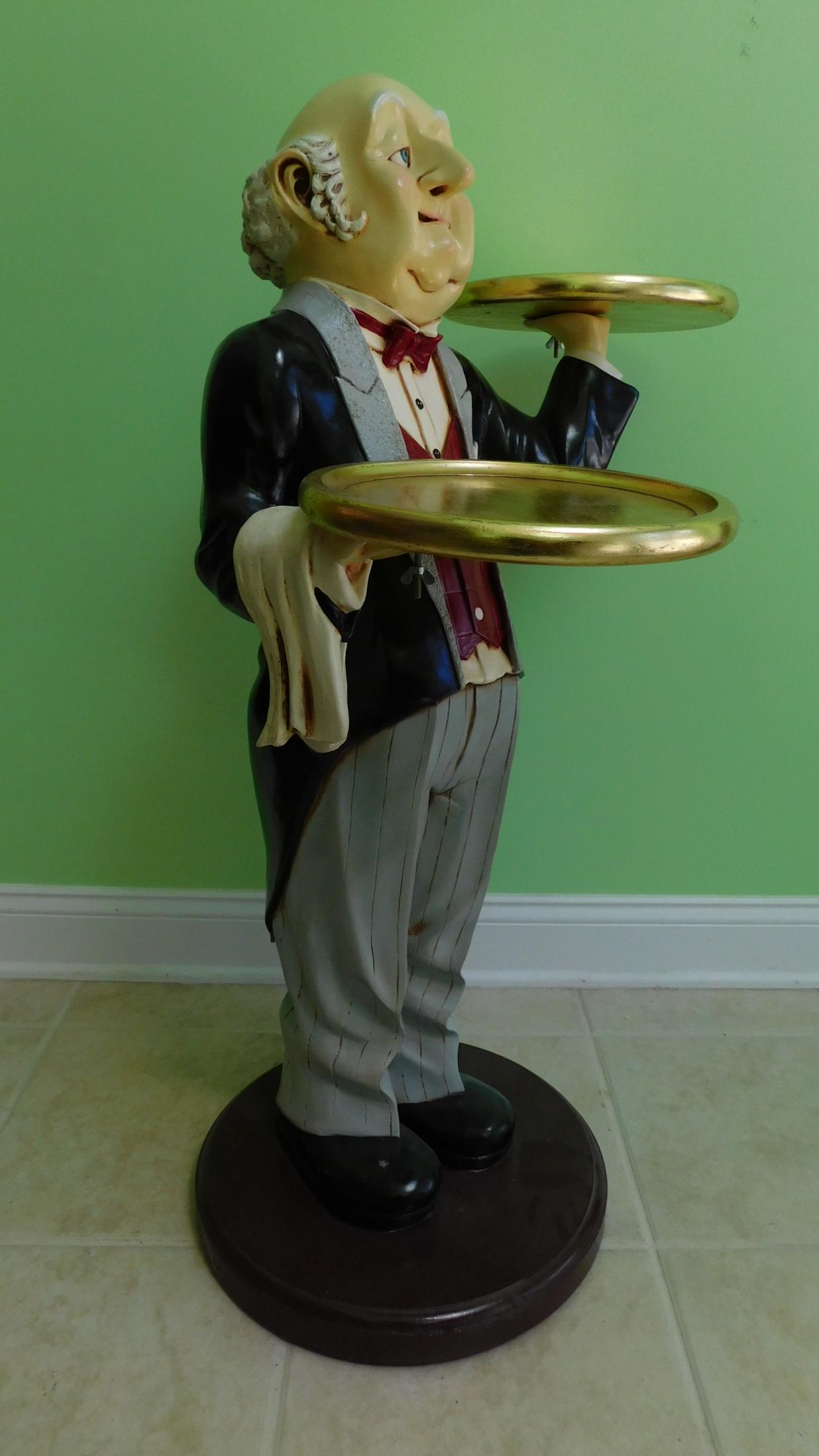 36" BUTLER STATUE: A COMPOSITE 36" TALL BUTLER STATUE COMPLETE WITH TWO SERVING TRAYS.
