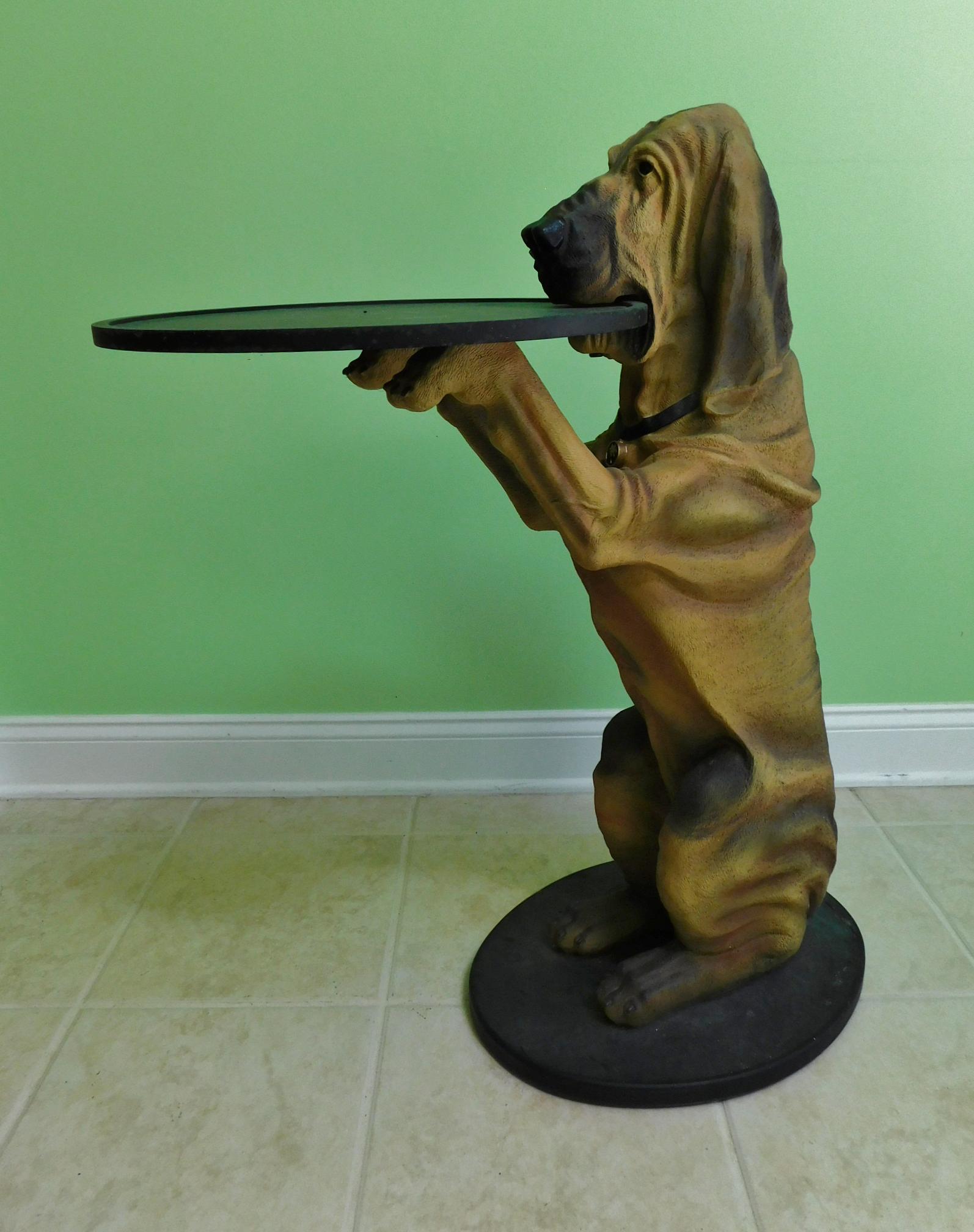 DOG SERVANT STATUE: A 33" TALL COMPOSITE DOG STATUE COMPLETE WITH SERVING TRAY.