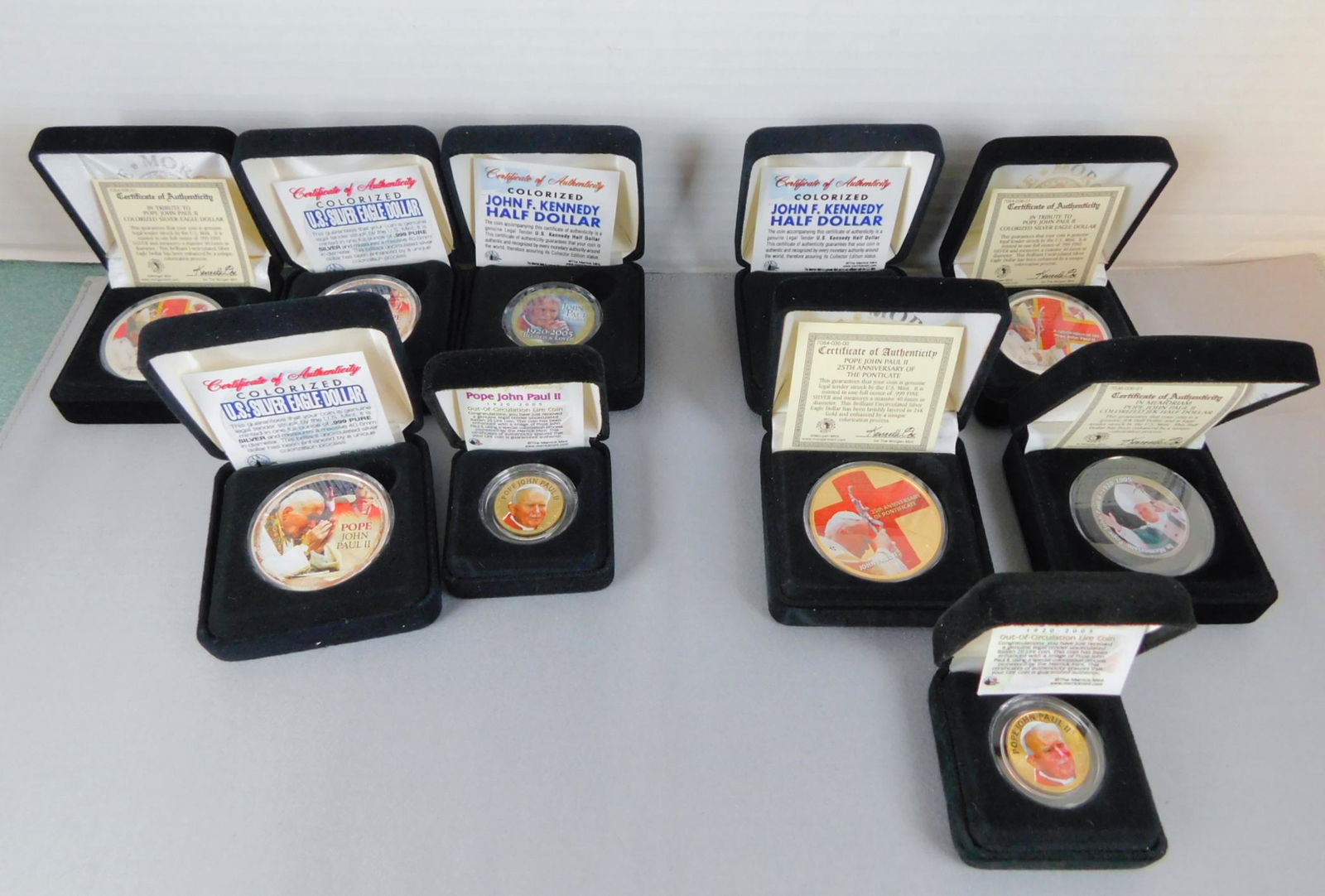 10 PC POPE JOHN PAUL COLORIZED COIN COLLECTION: POPE JOHN PAUL COLORIZED COIN COLLECTION CONSISTING OF FIVE SILVER EAGLES, THREE KENNEDY HALVES, TWO JEFFERSON NICKELS.