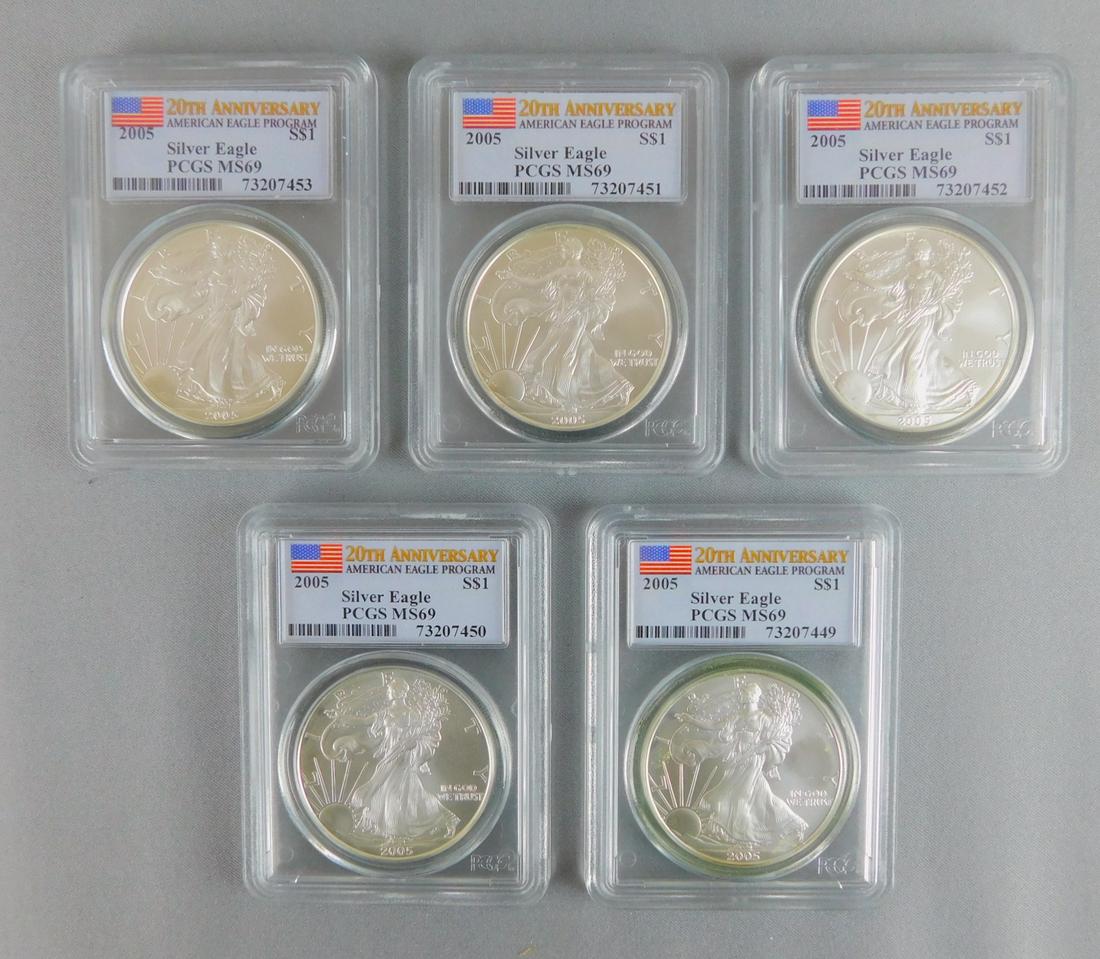 FIVE 2005 GRADED 20TH ANNIVERSARY SILVER EAGLES: A LOT OF FIVE 2005 20TH ANNIVERSARY PCGS GRADED MS69 SILVER EAGLES.