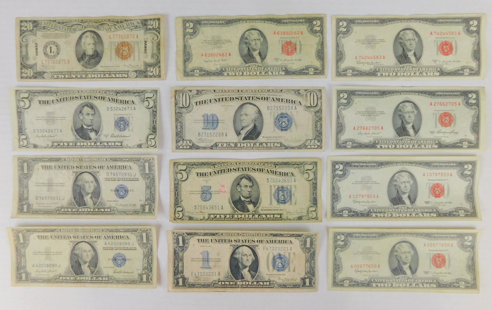 LOT OF ASSORTED BANK NOTES: A LOT OF ASSORTED BANK NOTES INCLUDING $1 SILVER CERTS, $2 RED SEAL NOTES, $5 SILVER CERTS, $10 SILVER CERTS, AND A $20 BROWN SEAL.