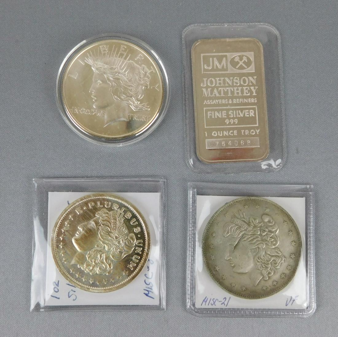 SILVER ROUNDS AND ONE JOHNSON MATTHEY SILVER TRADE UNIT: ONE PEACE DOLLAR ; TWO MORGANS AND ONE TRADE UNIT
