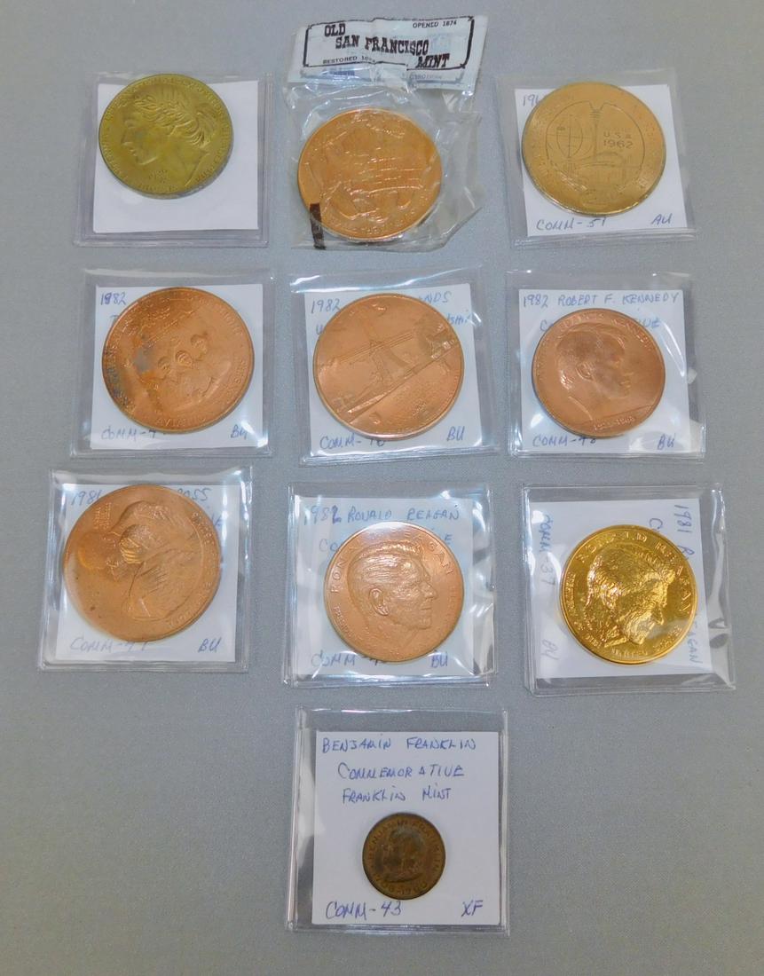 MEDALLIONS: 1706-1790 BENJAMIN FRANKLIN COM. FRANKLIN MINT; 1982 ROBERT F KENNEDY COM.; 1981 RONALD REAGAN COM.; 1982 RONALD REAGAN COM.; 1962 SEATTLE WORLD'S FAIR $1; 1982 NETHERLANDS US FRIENDSHIP 200 YEARS COM