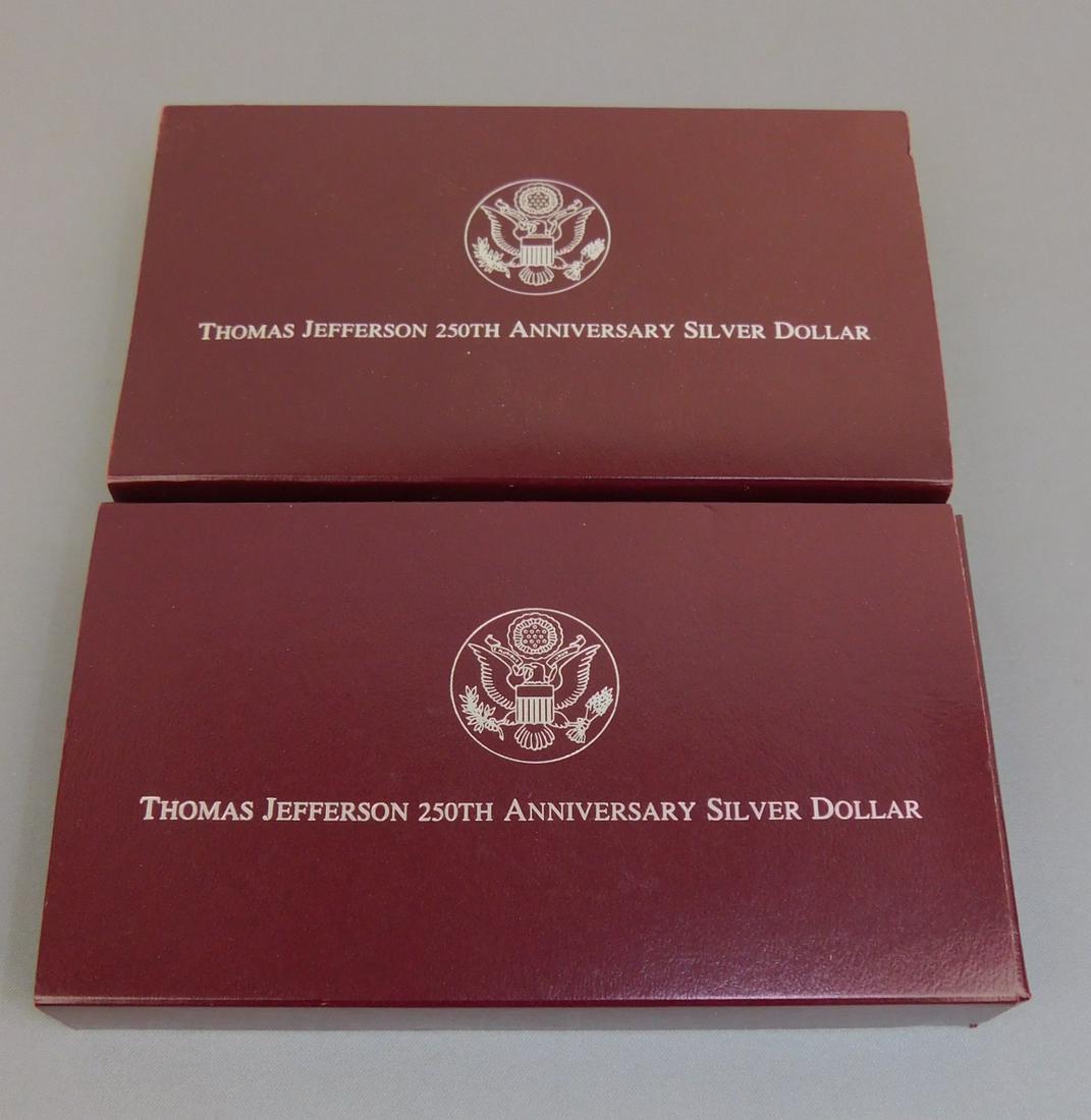 THOMAS JEFFERSON 250TH ANNIV SILVER DOLLAR SETS: (2 COUNT) THOMAS JEFFERSON 250TH ANNIVERSARY SILVER DOLLAR SETS