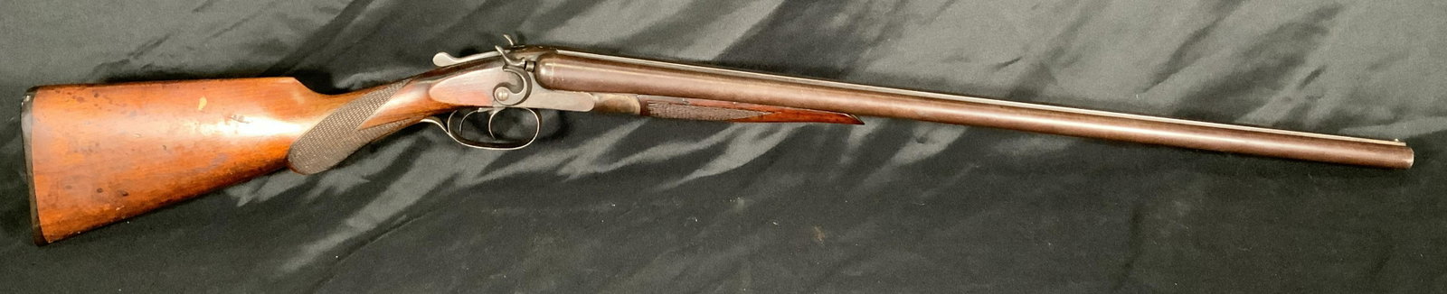 NEWBAKER 12 GAUGE PERCUSSION CAP DOUBLE BARREL SHOTGUN SERIAL NO. 20912: NEWBAKER 12 GAUGE PERCUSSION CAP DOUBLE BARREL SHOTGUN SERIAL NO. 20912. THIS FIREARM NEEDS TO BE REGISTERED.