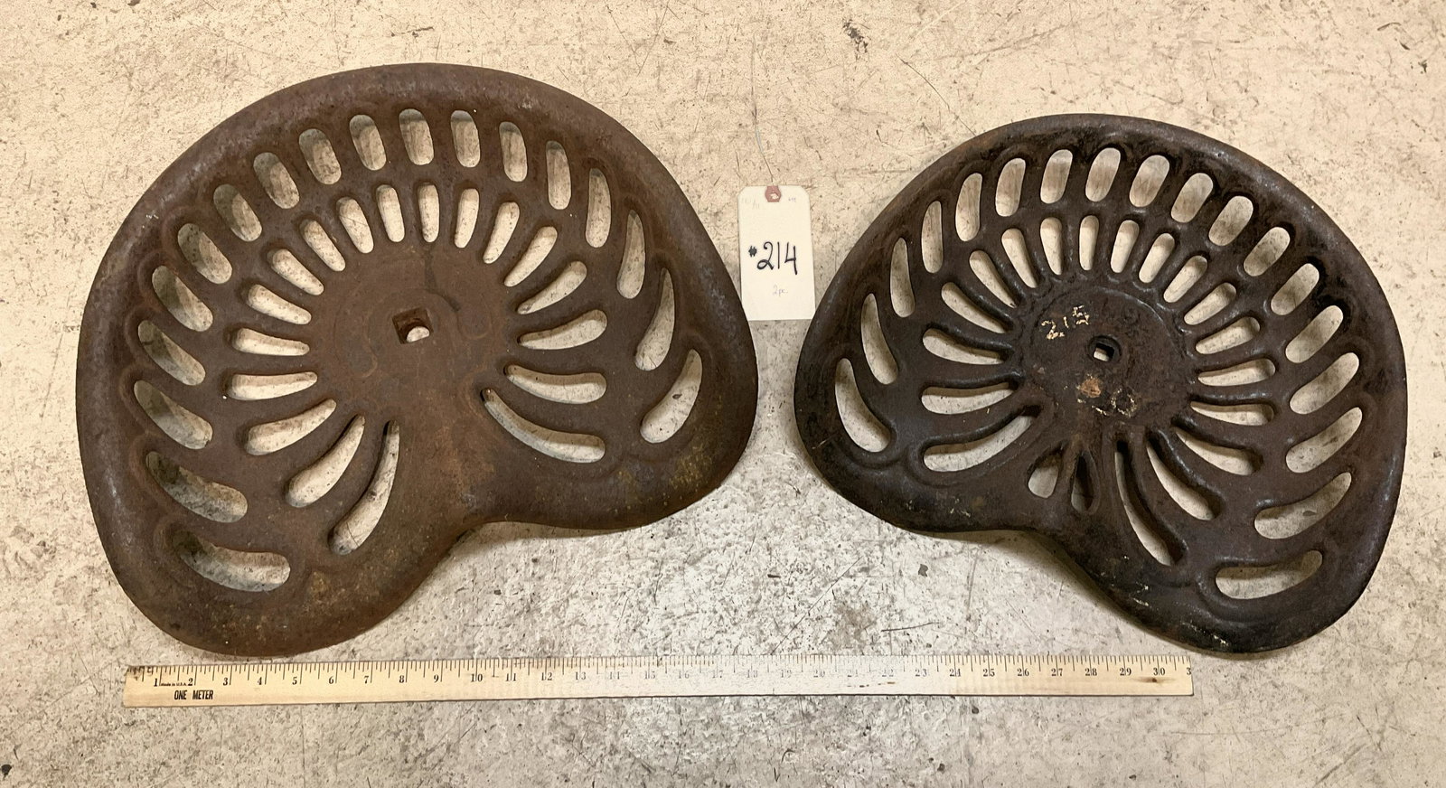 PAIR OF VINTAGE CAST IRON TRACTOR SEATS. (1 of 2)