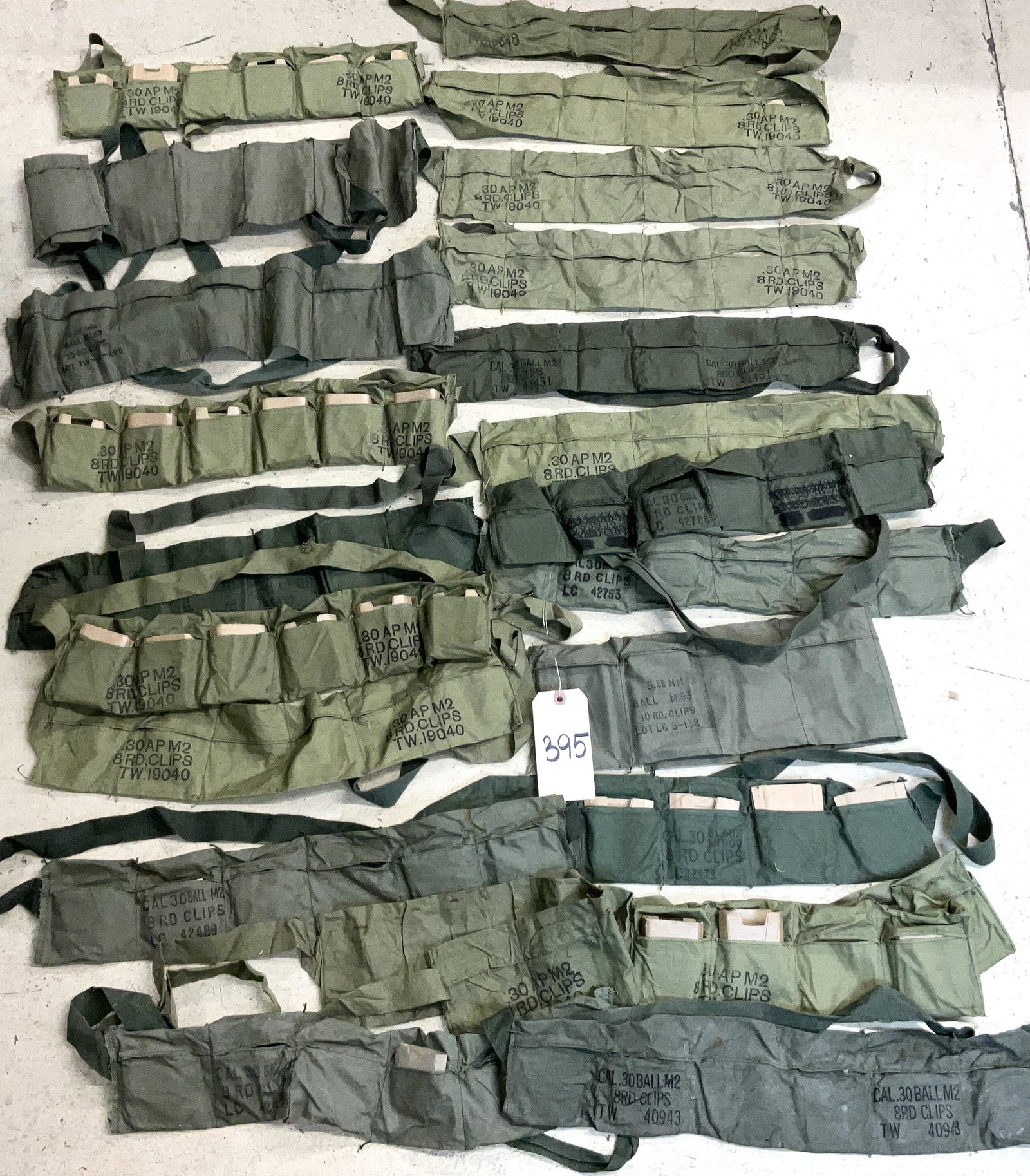 ASSORTED EMPTY AMMO BELTS, WITH SOME CARBOARD.: ASSORTED EMPTY AMMO BELTS, WITH SOME CARBOARD.