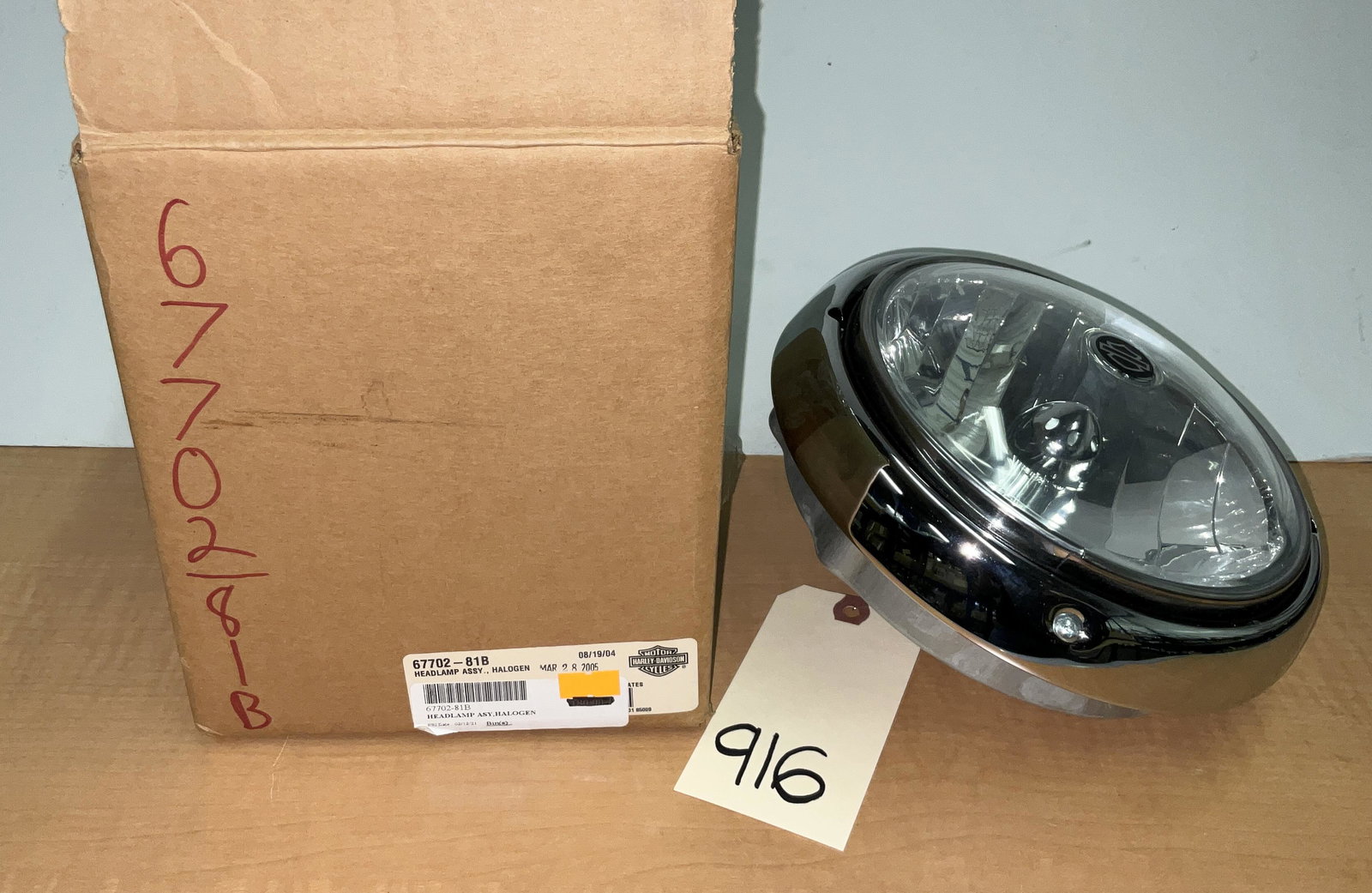 HD HEADLAMP ASSY HALOGEN BULB PN 67702-81B: HD HEADLAMP ASSY HALOGEN BULB PN 67702-81B Condition All property is sold in "as is" condition and all sales are final. Teel Auctions and its consignor make no representations or warranties, express o