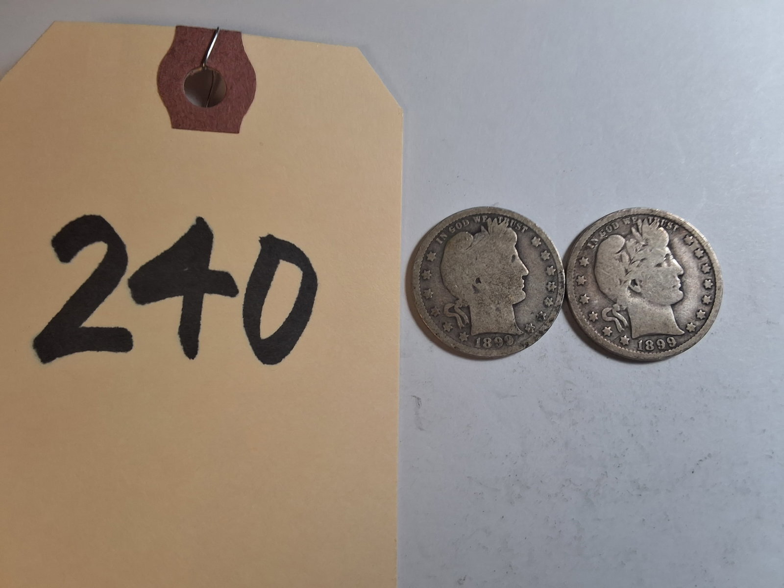 Lot of 2 Barber Quarters 25C - 1899 O: Lot of 2 Barber Quarters 25C - 1899 O Condition All property is sold in "as is" condition and all sales are final. Teel Auctions and its consignor make no representations or warranties, express or imp