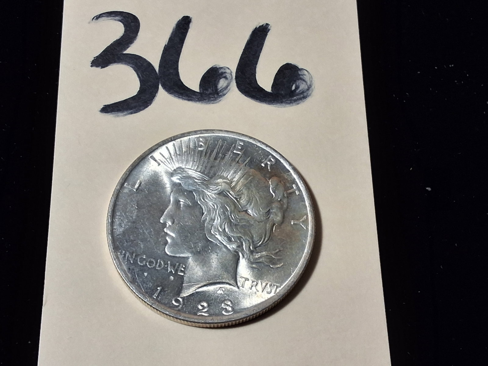 1923 Peace Dollar $1: 1923 Peace Dollar $1 Condition All property is sold in "as is" condition and all sales are final. Teel Auctions and its consignor make no representations or warranties, express or implied, with respec