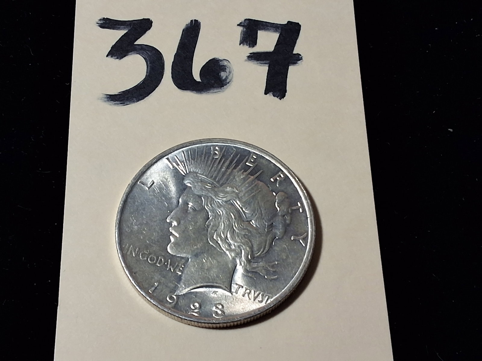 1923 Peace Dollar $1: 1923 Peace Dollar $1 Condition All property is sold in "as is" condition and all sales are final. Teel Auctions and its consignor make no representations or warranties, express or implied, with respec